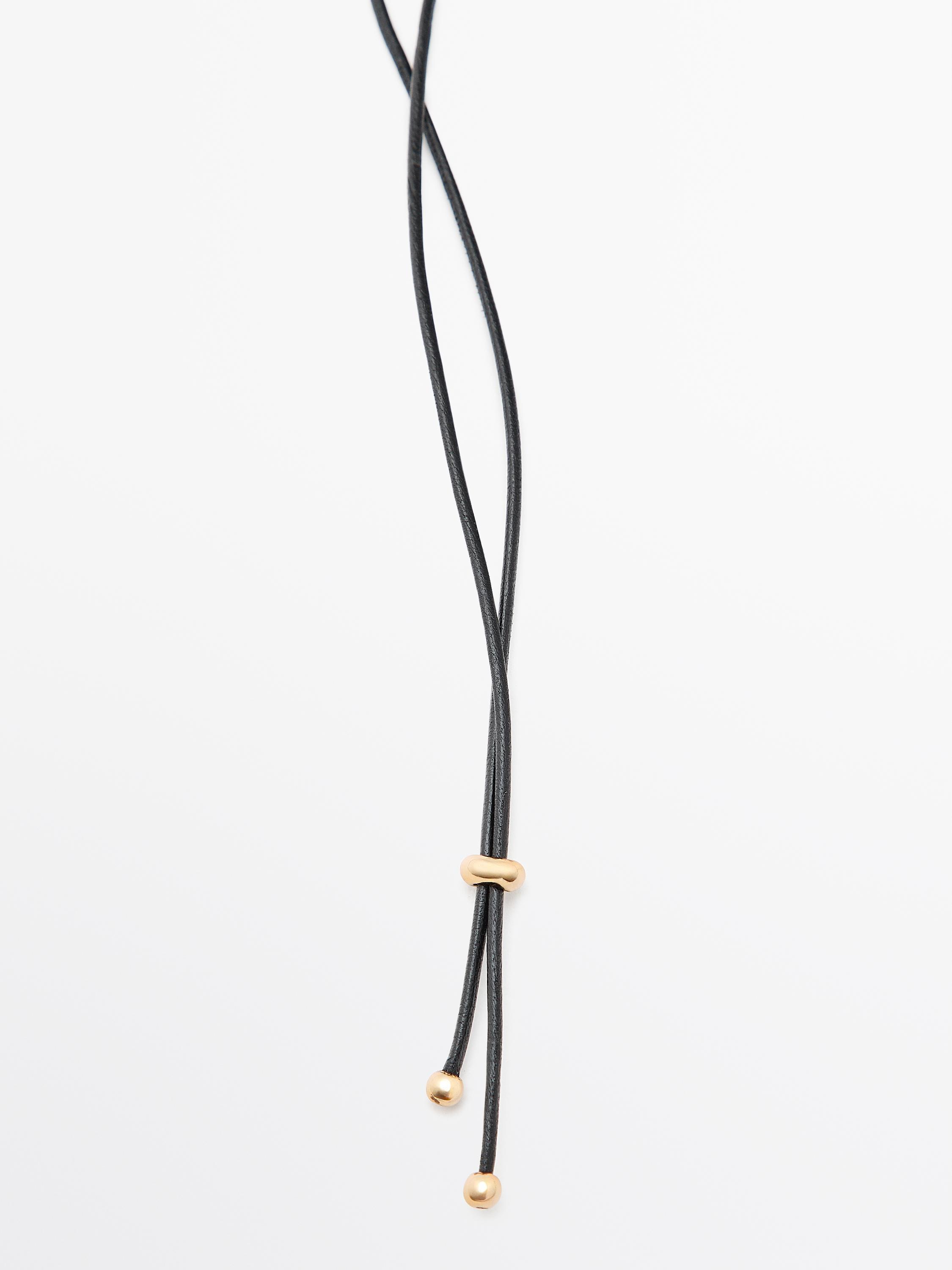 Pendentif pièce en cuir